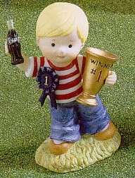Coca-Cola Kids Boy With Trophy And Blue Ribbon Figurine - 
859583