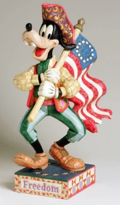 DISNEY TRADITIONS GOOFY CARRYING THE AMERICAN FLAG FIGURINE BY JIM SHORE