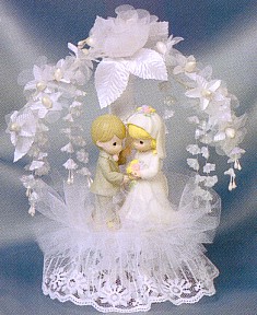 PRECIOUS MOMENTS WHITE CAKE TOPPER WITH FLOWERED ARCH